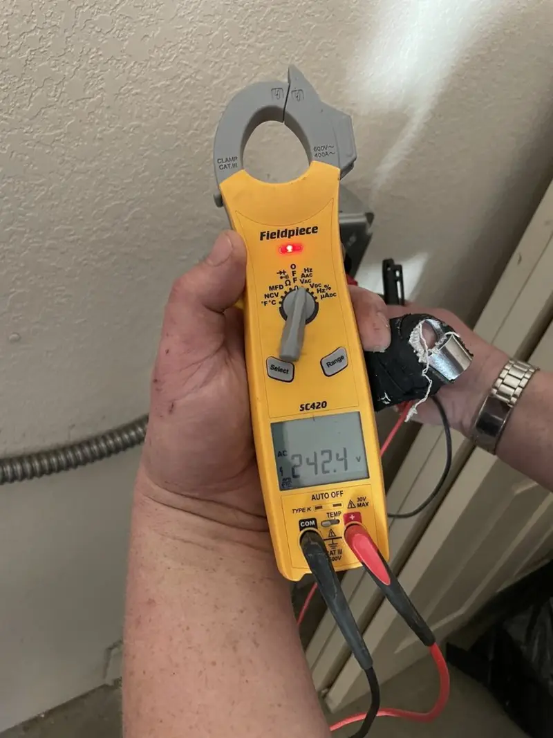Voltage testing with clamp meter during Outlet Installation in Plainville